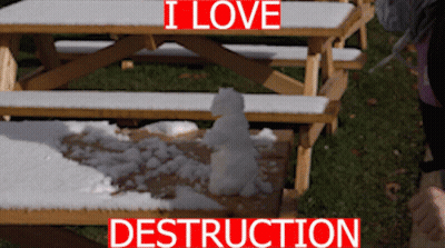 A Snowman Sits On A Picnic Table With The Words I Love Destruction Below It GIF