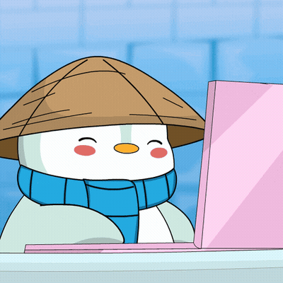 A Snowman Wearing A Hat And Scarf Is Sitting In Front Of A Laptop GIF