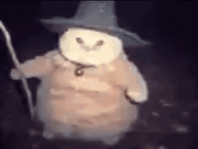 A Snowman Wearing A Wizard Hat And Holding A Cane . GIF