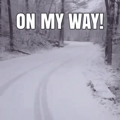 A Snowy Road In The Woods With The Words On My Way GIF