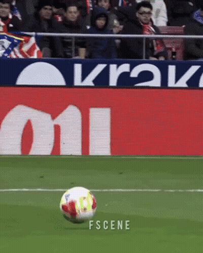 A Soccer Ball Is Being Kicked In Front Of A Sign That Says Krak On It GIF