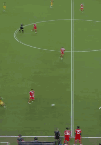 A Soccer Field With A Banner That Says " Futbol Unites " On It GIF