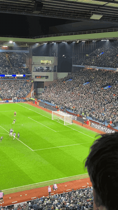 A Soccer Field With A Mastercard Banner On The Side GIF