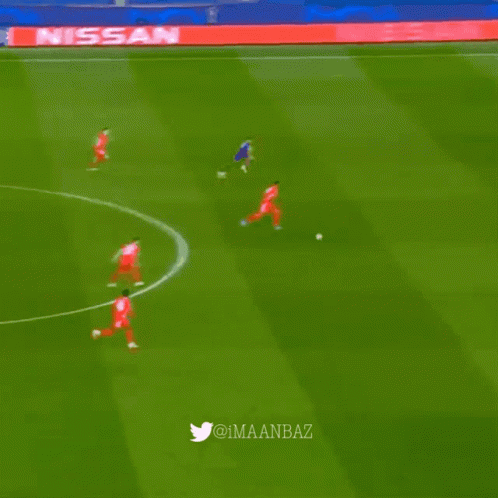 A Soccer Field With A Nissan Sign On The Side GIF