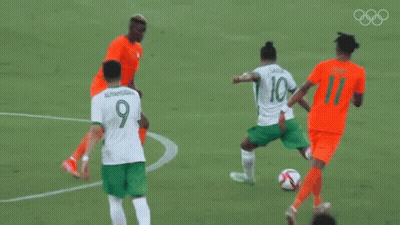 A Soccer Field With A Sign That Says Tokyo 2020 On It GIF