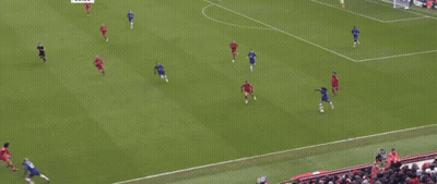 A Soccer Field With Carlsberg Advertisements On The Side GIF
