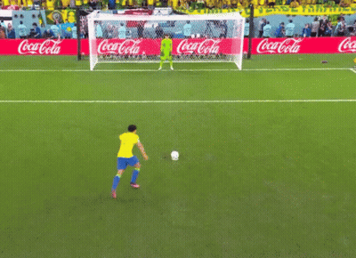 A Soccer Field With Coca Cola Advertisements On The Side GIF
