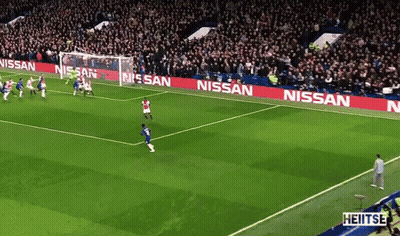 A Soccer Field With Nissan Advertisements On The Side GIF