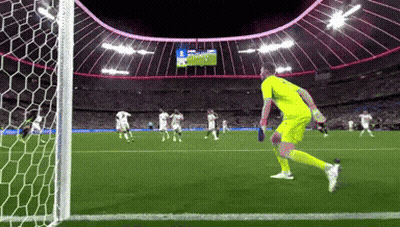 A Soccer Game Is Being Played In A Stadium And The Goalie Is Wearing A Yellow Uniform GIF