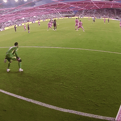 A Soccer Game Is Being Played In A Stadium That Has A Sign That Says ' Liverpool ' On It GIF