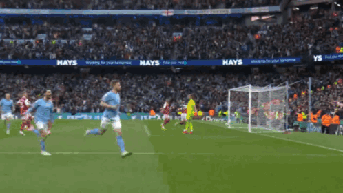A Soccer Game Is Being Played In A Stadium With A Hays Ad In The Background GIF