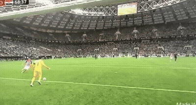 A Soccer Game Is Being Played In A Stadium With A Lot Of People Watching . GIF