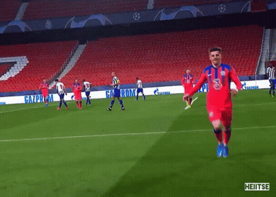 A Soccer Game Is Being Played In An Empty Stadium With Advertisements For Gazprom GIF