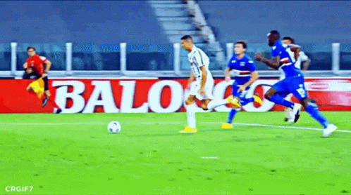 A Soccer Game Is Being Played In Front Of A Banner That Says Baloo GIF