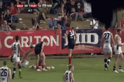 A Soccer Game Is Being Played In Front Of A Banner That Says Carlton Id GIF