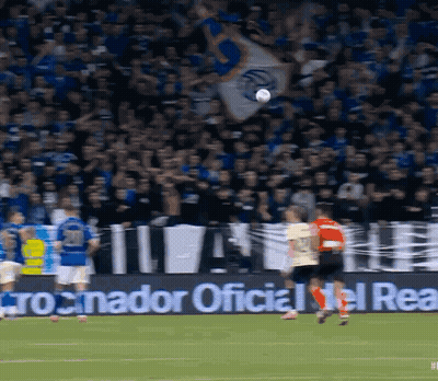 A Soccer Game Is Being Played In Front Of A Banner That Says " Cronador Oficial Del Real " GIF