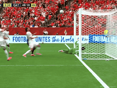 A Soccer Game Is Being Played In Front Of A Banner That Says " Football Unites The World " GIF
