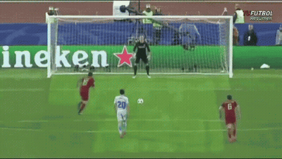 A Soccer Game Is Being Played In Front Of A Banner That Says Heineken GIF