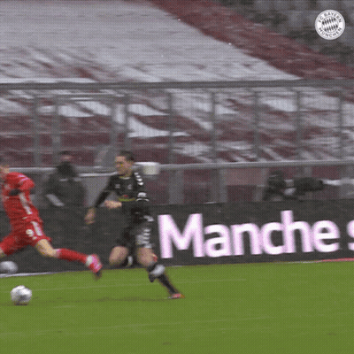 A Soccer Game Is Being Played In Front Of A Banner That Says " Manches " GIF