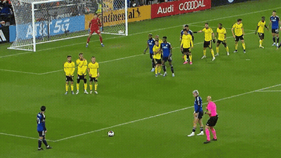 A Soccer Game Is Being Played In Front Of A Continental Ad GIF