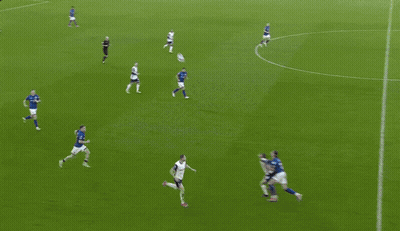 A Soccer Game Is Being Played In Front Of A Crowd And A Scoreboard That Says Premier League On It GIF