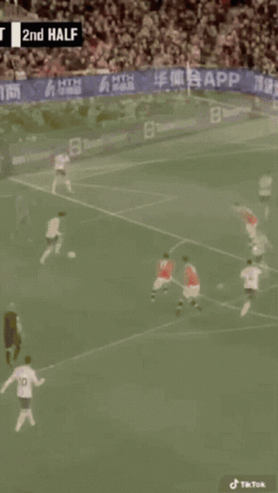 A Soccer Game Is Being Played In Front Of A Crowd With A Banner That Says App On It GIF
