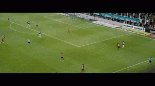 A Soccer Game Is Being Played In Front Of A Crowd With A Sign That Says Emirates GIF