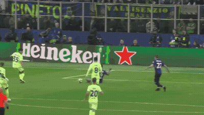 A Soccer Game Is Being Played In Front Of A Heineken Advertisement GIF
