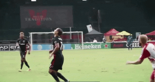 A Soccer Game Is Being Played In Front Of A Heineken Sign GIF