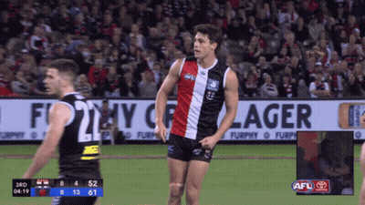 A Soccer Game Is Being Played In Front Of A Large Banner That Says Furphy Lager GIF