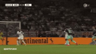 A Soccer Game Is Being Played In Front Of A Large Continental Ad GIF