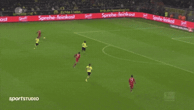 A Soccer Game Is Being Played In Front Of A Large Flyeralarm Banner GIF