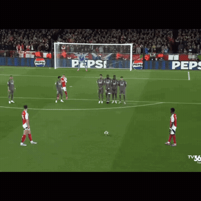 A Soccer Game Is Being Played In Front Of A Pepsi Ad GIF