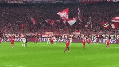 A Soccer Game Is Being Played In Front Of A Qatar Airways Ad GIF