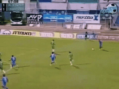 A Soccer Game Is Being Played In Front Of A Scoreboard That Says 67-08 On It GIF