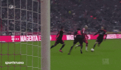 A Soccer Game Is Being Played In Front Of A Sign That Says Magenta GIF