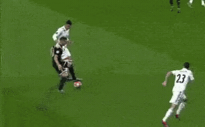 A Soccer Game Is Being Played In Front Of A Sign That Says ' Pdnsibly ' On It GIF