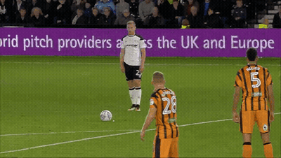 A Soccer Game Is Being Played In Front Of A Sign That Says ' Pitch Providers Across The Uk And Europe ' GIF