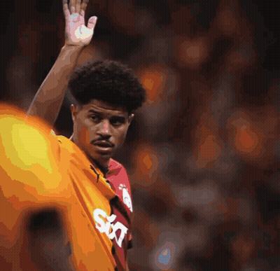 A Soccer Game Is Being Played In Front Of A Sign That Says Vakif GIF