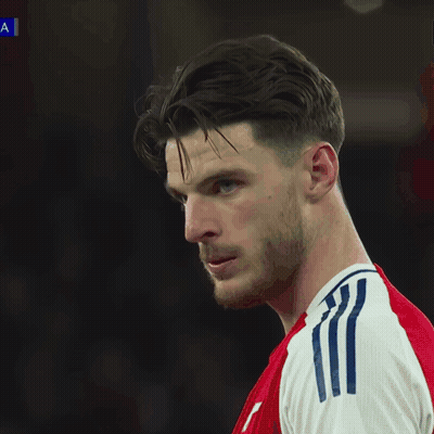 A Soccer Game Is Being Played In Front Of An Ad For Ps5 GIF