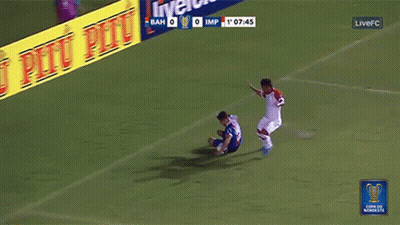 A Soccer Game Is Being Played In Front Of An Advertisement For Pitu Pitu GIF