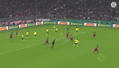 A Soccer Game Is Being Played On A Field That Has Advertisements For Bitburger GIF
