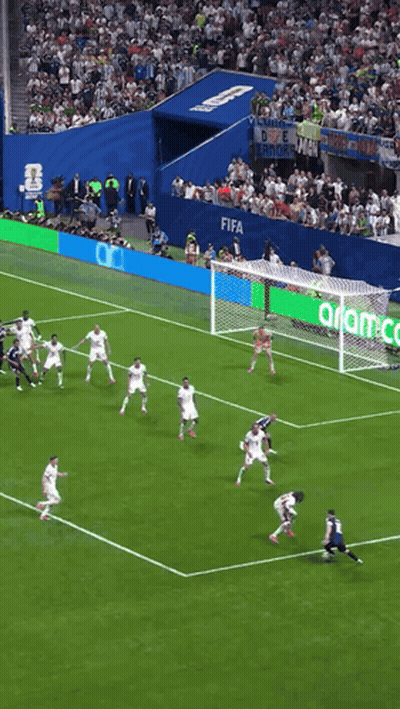 A Soccer Game Is Being Played On A Field That Has Fifa Written On The Fence GIF