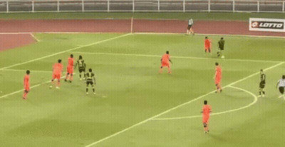 A Soccer Game Is Being Played On A Field With A Banner Behind The Goal That Says Bell GIF