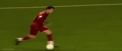 A Soccer Game Is Being Played On A Field With A Banner That Says Kmn GIF