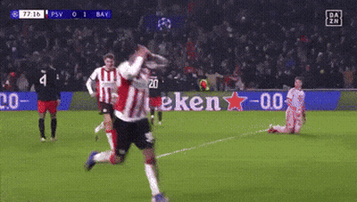A Soccer Game Is Being Played On A Field With A Heineken Sign In The Background GIF