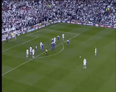 A Soccer Game Is Being Played On A Field With A Large Crowd Watching . GIF