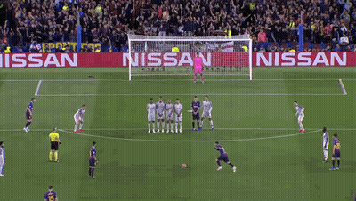 A Soccer Game Is Being Played On A Field With A Nissan Banner Behind The Goal GIF