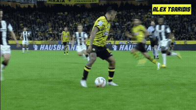 A Soccer Game Is Being Played On A Field With Ads For Hausbean And Alex Tsaridis GIF