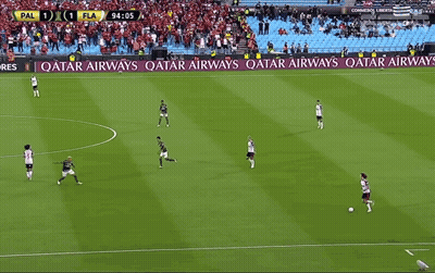 A Soccer Game Is Being Played On A Field With Ads For Qatar Airways And Betfair GIF